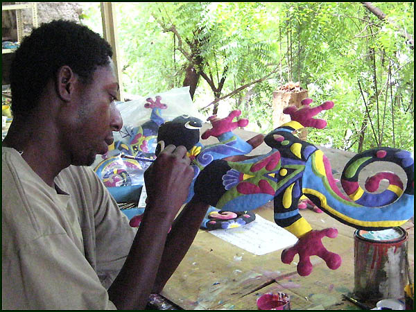 Haitian artist - Painting tropical metal art - Haitian steel drum art.. - www.tropicdecor.com